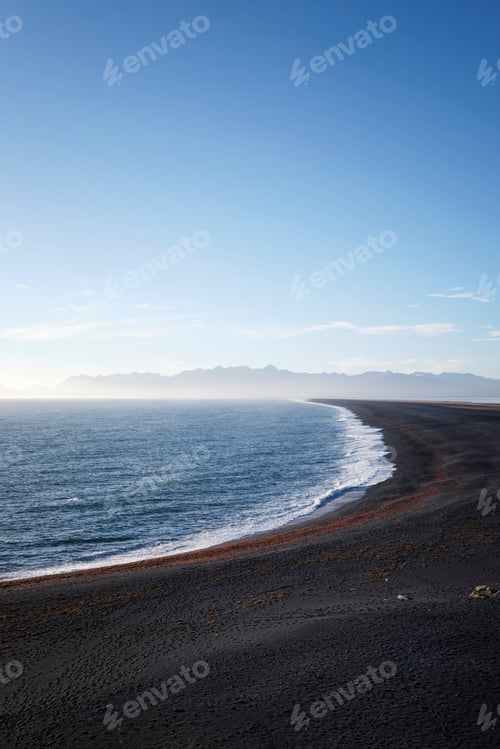 Preview: Vertical of beautiful Hvalnes beach with black sand in Iceland.