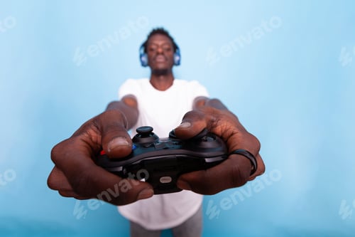 Preview: Close up of video games controller in hands of man