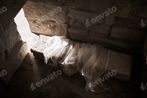 Preview: Empty tomb while light shines from the outside. Jesus Christ Resurrection. Christian Easter concept.