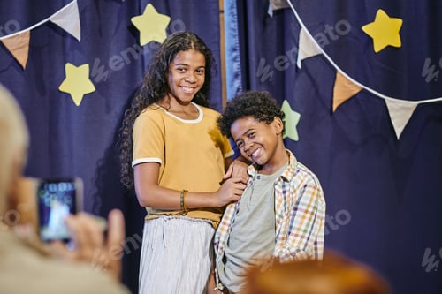 Preview: Happy children posing at camera after performance