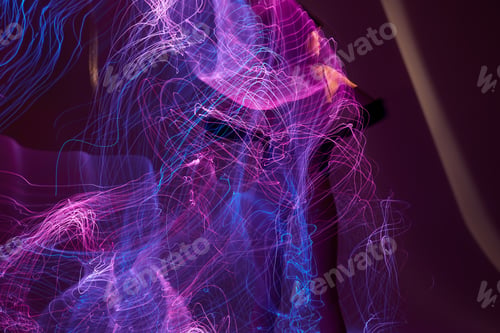 Preview: Portrait of a charming lady neon lines posing model glamor color background unaltered