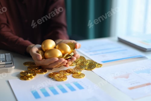 Preview: Gold coins and golden eggs in businessman’s hands symbolizing financial growth and investment