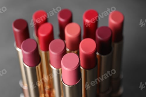 Preview: Set of bright lipsticks on grey background