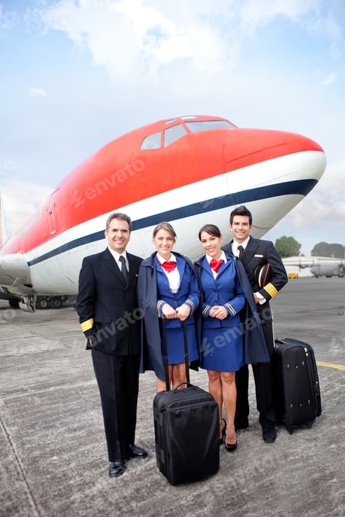 Preview: Airplane Cabin Crew Standing At The Airport With Bags
