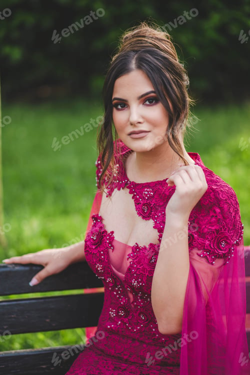 Preview: Vertical shot of a white Caucasian woman posing on a blurred background