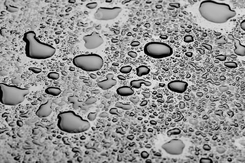 Preview: water drops splash on the black floor