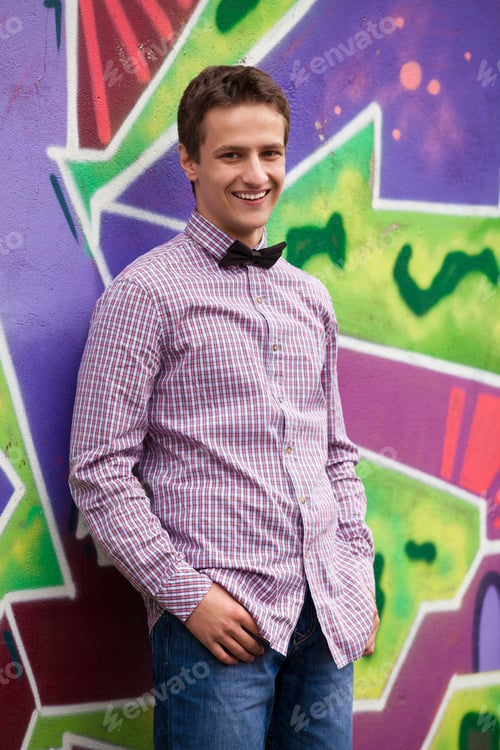 Preview: Style teen boy near graffiti background.