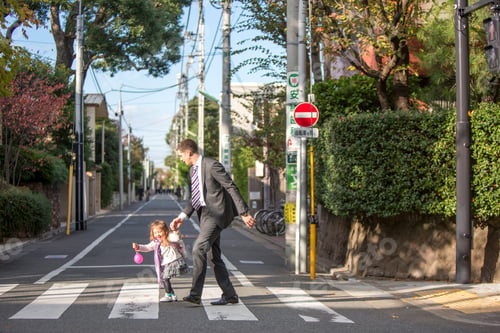 Preview: Father and daughter crossing zebra crossing