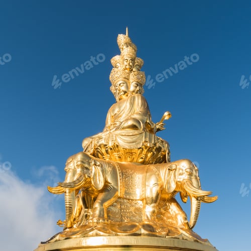Preview: gold buddha against a blue sky