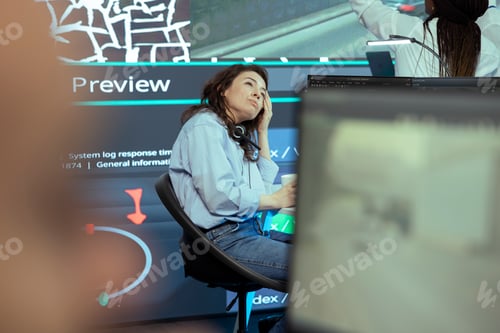 Preview: Stressed operator working under pressure in monitoring room headquarters