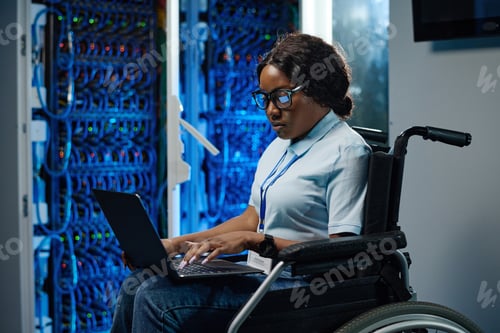 Preview: Female engineer with disability working in data center