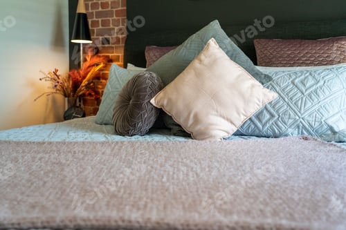 Preview: Bedding in modern comfortable hotel room with clean bedsheets and pillow with natural light