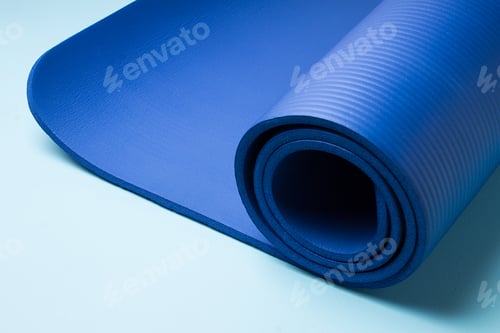 Preview: Rolled Blue Exercise Mat on Light Blue Surface