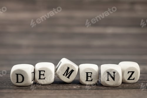 Preview: Selective focus shot of wood cubes with the german word for dementia