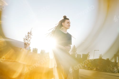 Preview: Portrait of young happy woman with dreadlocks