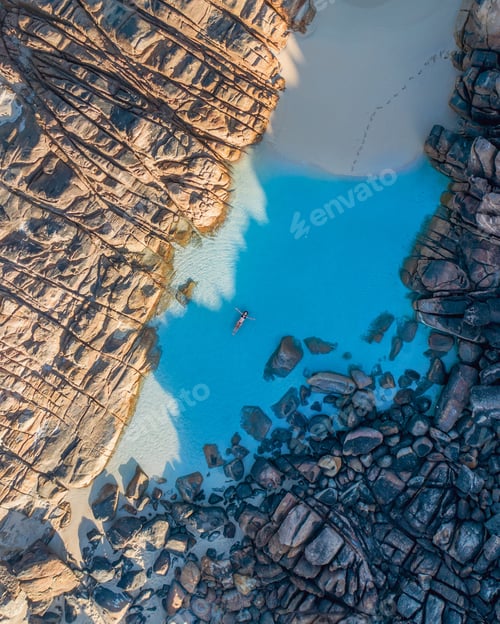 Preview: A person floating in a pristine blue water