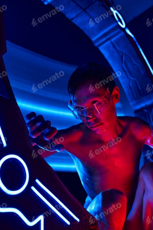 Preview: cosmic phenomenon, humanoid alien in goggles looking out experimental device in futuristic lab