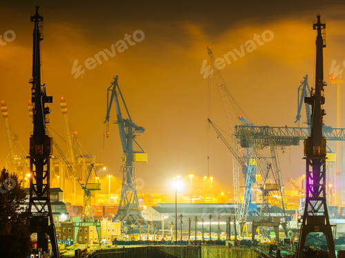 Preview: Germany, Hamburg, harbour cranes at Port of Hamburg by night