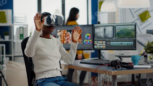 Preview: African video editor experiencing VR goggles