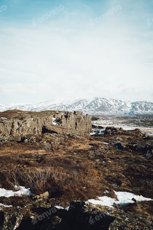 Preview: Rugged landscape with snowy mountains in Iceland.