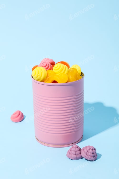 Preview: Jelly candies in purple tin on blue background