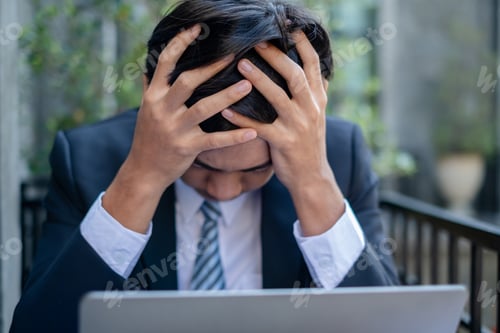 Preview: Working Asian men feel stressed, tired from work, migraine headaches from hard work while working