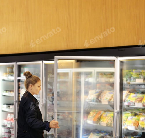 Preview: Woman Choosing Frozen Food From A Supermarket Freezer