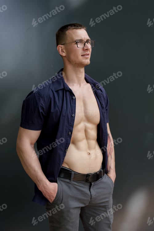 Preview: Confident man with glasses and open shirt posing