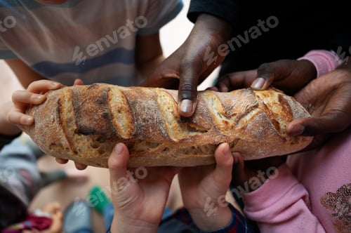 Preview: Black and white children holding loaf of bread
