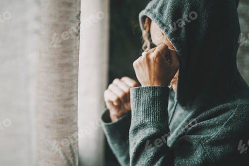 Preview: Woman having a bad day with desperation and frustration. Side view of lonely female at home