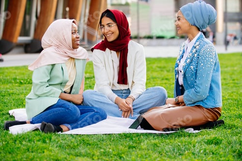 Preview: Beautiful muslim girl wearing hijab bonding outdoors