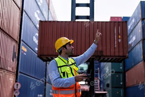 Preview: Engineer working in container storage yard fly drone looking location layout prepare to delivery
