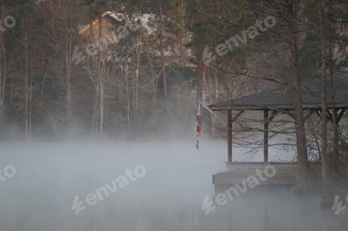 Preview: Two story house nestled among the pines. Foggy lake this morning. Finding fog