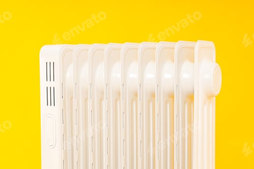 Preview: Modern white electric heater on yellow background