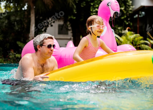 Preview: Caucasian father daughter enjoying summer time together in the p