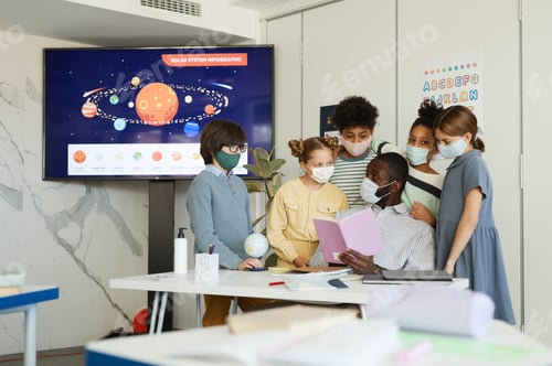 Preview: Kids with Teacher in Classroom
