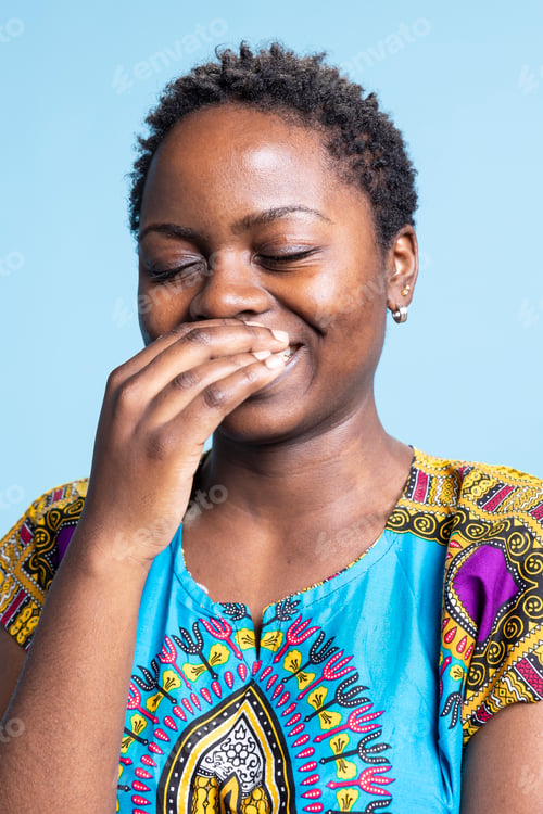 Preview: Joyful african american model standing over blue background