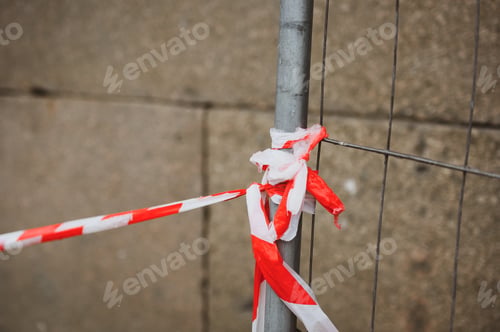 Preview: Red and white barrier tape in the street