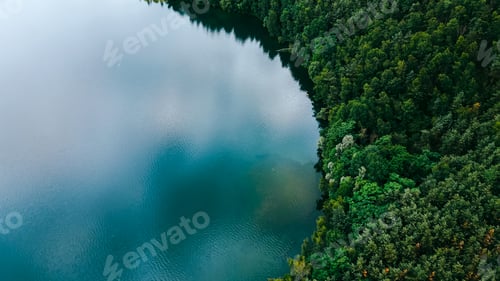 Preview: Aerial drone top down view of lake among forest, Nordrhein westfalen, Germany in summer day.