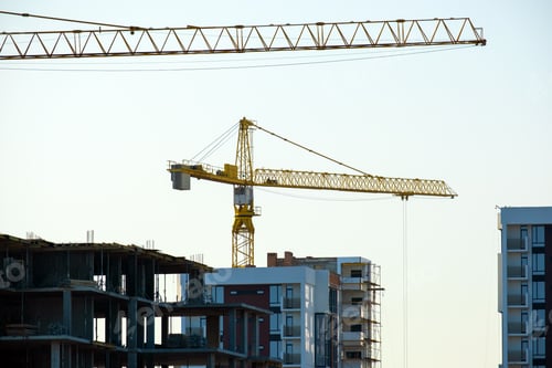 Preview: Aerial view of tower cranes and high residential apartment buildings under construction