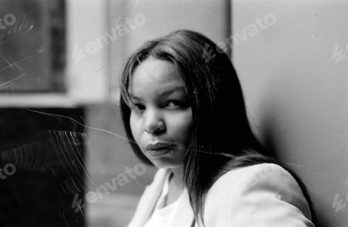 Preview: Young woman posing with analog film look, grainy black and white photo