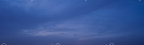 Preview: Sunset sky. Abstract nature background. Dramatic blue and orange, colorful clouds at twilight time.