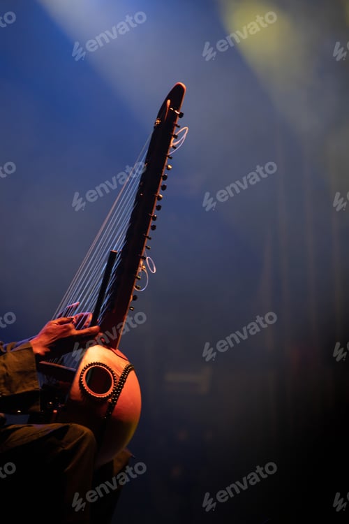 Preview: Muscian playing a string insturment called the Kora.
