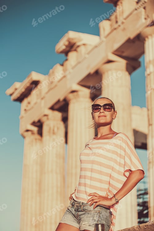 Preview: Happy girl tourist visits Acropolis. Greece