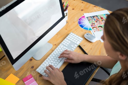 Preview: Woman working on desktop pc