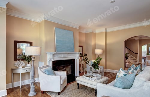 Preview: spacious livingroom with fireplace and tasteful furniture.