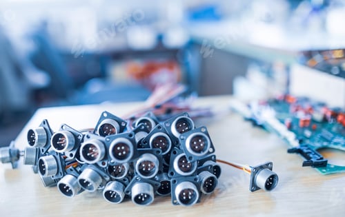 Preview: Close-up blurry metal sockets for plugs are in a heap