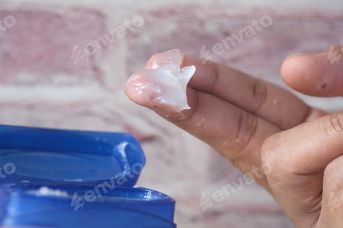 Preview: Close up of man hand using petroleum jelly