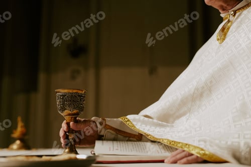 Preview: Pastor Putting Cup Of Wine On Communion Table