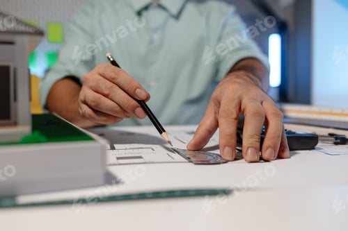 Preview: The architect is working on blueprint of important project by using his creativity, the engineer dra